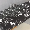 Kurbits svart-grå tyg med dalahästar