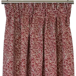 Ramas röd-beige gardiner med kvistar och blad